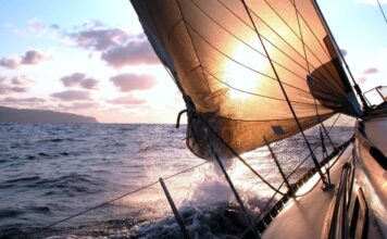 Your First Overnight Sail: How to Prepare as Crew Yacht sailing into the evening sun.