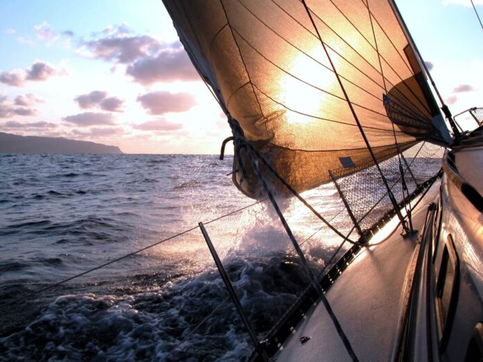 Yacht sailing into the evening sun Yacht sailing into the evening sun.